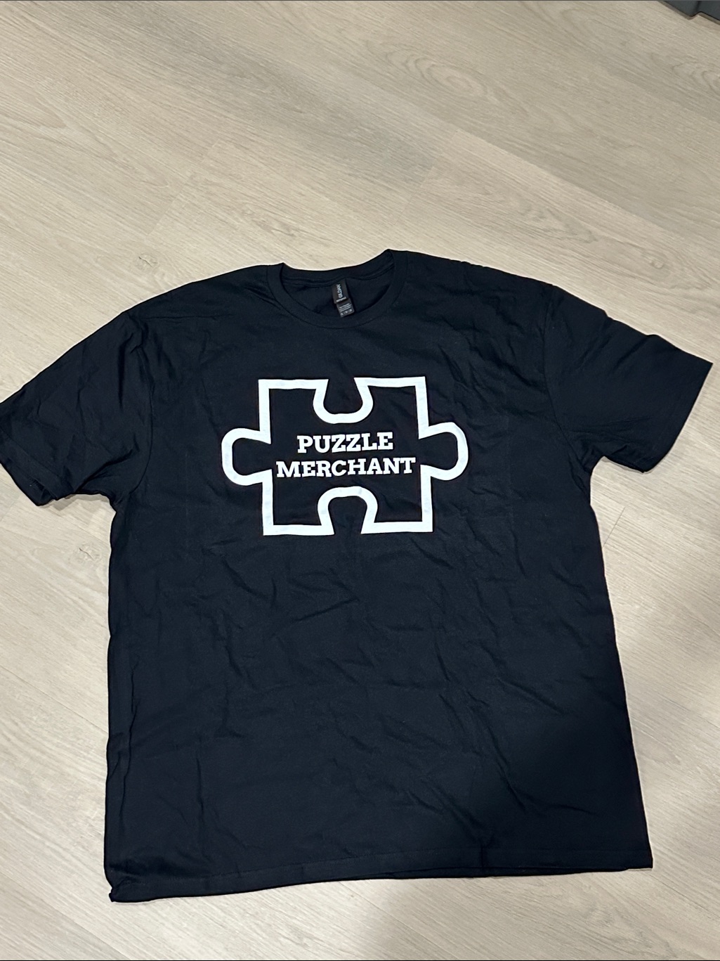 Puzzle Merchant Black TShirt Brand New